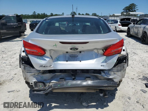 2017 Ford Focus SE with VIN 1FADP3F27HL223918, listed as a Copart auction lot 57464685 with 134,253 mi miles and Salvage title. Bid and sale history available at DreamBid. Image 6.