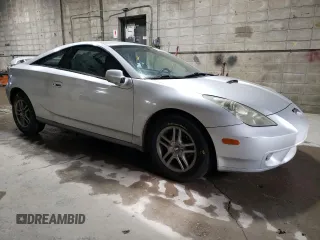2000 Toyota Celica GT with VIN JTDDR32TXY0021398, listed as a Copart auction lot 82529474 with 271,041 mi miles and Salvage Title. Bid and sale history available at carsss.com. Image 4.
