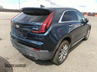 2021 Cadillac XT4 FWD Premium Luxury with VIN 1GYFZCR48MF004009, listed as a IAAI auction lot 41956723 with 82,483 mi miles. Bid and sale history available at carsss.com. Image 4.
