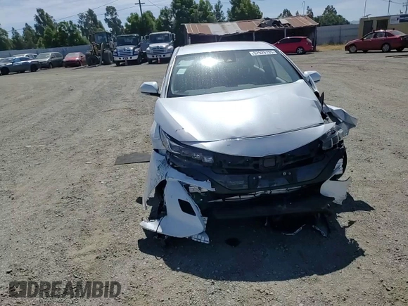 2021 Toyota Prius LE z VIN JTDKAMFP7M3191079, wystawiony jako Copart lot #57529195 z przebiegiem 52 809 mil mil oraz Szkoda całkowita • Salvage title. Historia ofert i sprzedaży dostępna na DreamBid. Obrazek 13.