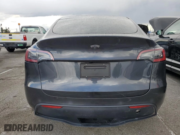 2024 Tesla Model Y with VIN 7SAYGDED1RF052031, listed as a Copart auction lot 48507865 with 5,365 mi miles and Salvage title. Bid and sale history available at DreamBid. Image 6.