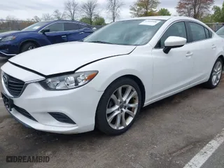 2014 Mazda Mazda6 i Touring with VIN JM1GJ1V59E1109421, listed as a IAAI auction lot 42094480 with 153,287 mi miles. Bid and sale history available at carsss.com. Image 2.