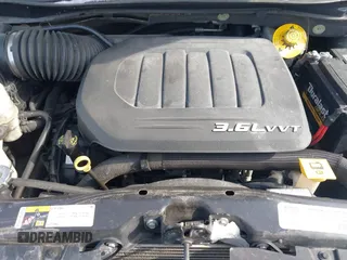 2015 Dodge Grand Caravan SE with VIN 2C4RDGBG3FR653239, listed as a IAAI auction lot 41607222 with 124,732 mi miles and . Bid and sale history available at DreamBid. Image 10.