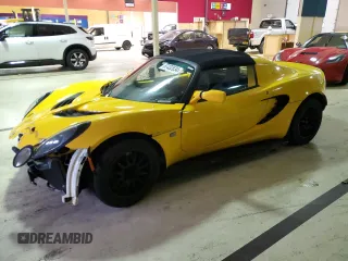 2005 Lotus Elise z VIN SCCPC11185HL33279, wystawiony jako Copart lot #87432634 z przebiegiem Nie podano mil oraz Szkody całkowita. Historia ofert i sprzedaży dostępna na DreamBid. Obrazek 1.