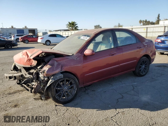 2005 Kia Spectra LX with VIN KNAFE122855108907, listed as a Copart auction lot 77502354 with Not Provided miles and Salvage Title. Bid and sale history available at carsss.com. Image 1.
