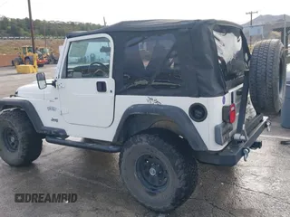 2001 Jeep Wrangler Sport with VIN 1J4FA49S41P308407, listed as a IAAI auction lot 41772240 with 139,461 mi miles. Bid and sale history available at carsss.com. Image 3.