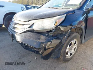 2014 Honda CR-V LX with VIN 3CZRM3H33EG701074, listed as a IAAI auction lot 41533756 with 127,928 mi miles. Bid and sale history available at carsss.com. Image 6.
