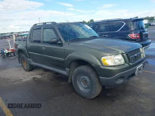 2004 Ford Explorer Sport Trac XLS z VIN 1FMZU77K04UA04328, wystawiony jako IAAI lot #42261985 z przebiegiem Nie podano mil oraz . Historia ofert i sprzedaży dostępna na DreamBid. Obrazek 1.