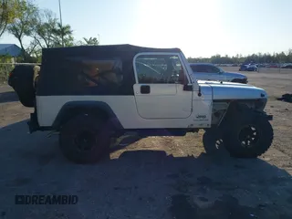 2005 Jeep Wrangler Unlimited with VIN 1J4FA44S65P335444, listed as a IAAI auction lot 41731093 with 143,918 mi miles. Bid and sale history available at carsss.com. Image 13.