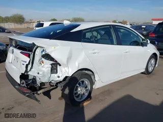 2021 Toyota Prius L Eco with VIN JTDKAMFU7M3133544, listed as a IAAI auction lot 41548653 with 115,214 mi miles. Bid and sale history available at carsss.com. Image 4.