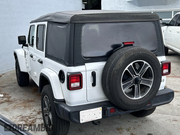2023 Jeep Wrangler Sahara with VIN 1C4HJXENXPW586579, listed as a IAAI auction lot 41795621 with 34,433 mi miles. Bid and sale history available at carsss.com. Image 3.