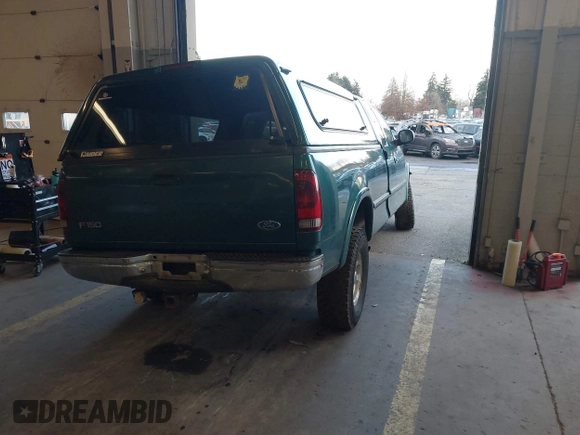 1997 Ford F-150 XL with VIN 1FTEX18L1VKB44867, listed as a IAAI auction lot 41266572 with 105,061 mi miles. Bid and sale history available at carsss.com. Image 4.