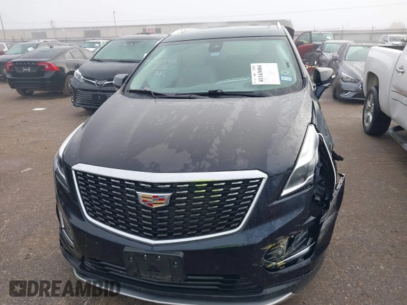2021 Cadillac XT5 FWD Premium Luxury with VIN 1GYKNCRS2MZ185678, listed as a IAAI auction lot 41143084 with 25,399 mi miles and . Bid and sale history available at carsss.com. Image 12.