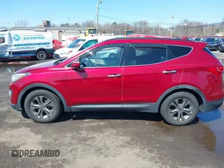 2014 Hyundai Santa Fe z VIN 5XYZUDLB3EG226857, wystawiony jako IAAI lot #41917762 z przebiegiem 42 677 mil mil oraz . Historia ofert i sprzedaży dostępna na DreamBid. Obrazek 14.