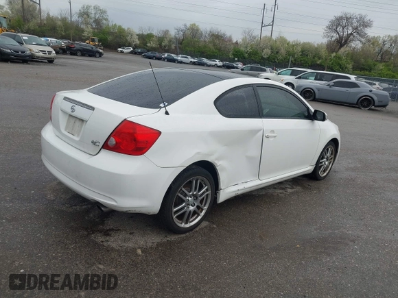 2007 Scion tC Spec with VIN JTKDE177270146530, listed as a IAAI auction lot 42033365 with 128,482 mi miles. Bid and sale history available at carsss.com. Image 4.