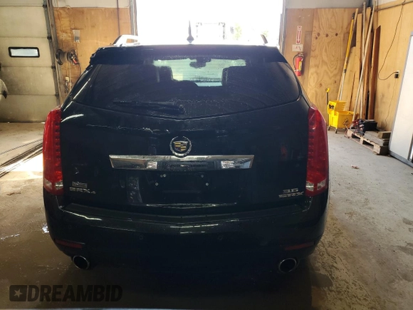 2014 Cadillac SRX Performance Collection z VIN 3GYFNFE31ES627978, wystawiony jako Copart lot #55437185 z przebiegiem 141 759 mil mil oraz Czysty tytuł • Clean title. Historia ofert i sprzedaży dostępna na DreamBid. Obrazek 6.
