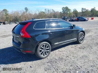2016 Volvo XC60 T6 Drive-E with VIN YV449MDK0G2825672, listed as a IAAI auction lot 41351214 with 140,633 mi miles. Bid and sale history available at carsss.com. Image 4.