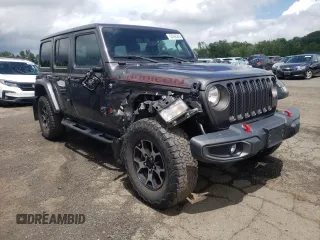 2018 Jeep Wrangler Unlimited Rubicon with VIN 1C4HJXFG1JW261472, listed as a Copart auction lot 63259345 with 60,457 mi miles and Salvage title. Bid and sale history available at DreamBid. Image 4.