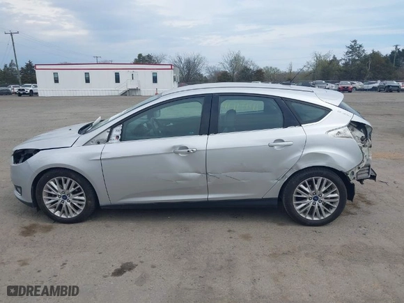 2015 Ford Focus Titanium with VIN 1FADP3N27FL228549, listed as a IAAI auction lot 41912941 with 69,025 mi miles. Bid and sale history available at carsss.com. Image 14.