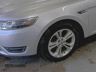 2016 Ford Taurus SEL with VIN 1FAHP2E88GG116319, listed as a IAAI auction lot 42189275 with 124,923 mi miles and . Bid and sale history available at DreamBid. Image 1.