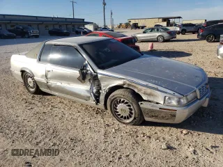 2000 Cadillac Eldorado Touring with VIN 1G6ET1295YU145248, listed as a Copart auction lot 82160574 with 87,294 mi miles and Salvage Title. Bid and sale history available at DreamBid. Image 4.
