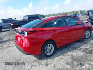 2021 Toyota Prius L Eco with VIN JTDKAMFU4M3145215, listed as a IAAI auction lot 41926274 with 74,220 mi miles. Bid and sale history available at carsss.com. Image 4.