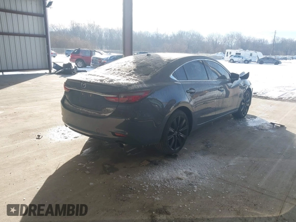 2021 Mazda 6 Carbon Edition with VIN JM1GL1WY6M1616617, listed as a IAAI auction lot 41365615 with 60,747 mi miles and . Bid and sale history available at DreamBid. Image 4.