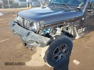 2018 Jeep Wrangler Unlimited Sport S with VIN 1C4HJXDN0JW255003, listed as a IAAI auction lot 41528394 with 55,660 mi miles and . Bid and sale history available at DreamBid. Image 6.