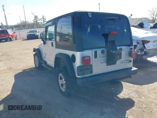 2004 Jeep Wrangler Sport Right Hand Drive with VIN 1J4F449SX4P780560, listed as a IAAI auction lot 41645721 with 146,681 mi miles. Bid and sale history available at carsss.com. Image 4.