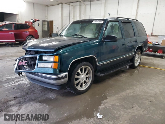 1998 GMC Yukon with VIN 1GKEC13RXWJ731667, listed as a Copart auction lot 78848954 with 202,164 mi miles and Salvage Title. Bid and sale history available at carsss.com. Image 1.