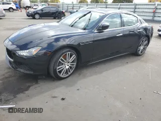 2015 Maserati Ghibli z VIN ZAM57XSA5F1129866, wystawiony jako Copart lot #51738015 z przebiegiem Nie podano mil oraz Szkoda całkowita • Salvage title. Historia ofert i sprzedaży dostępna na DreamBid. Obrazek 1.