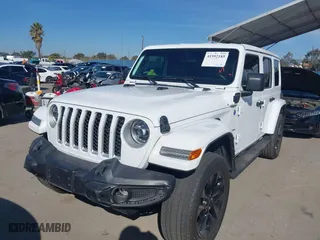 2021 Jeep Wrangler 4xe Unlimited Sahara with VIN 1C4JJXP6XMW765398, listed as a IAAI auction lot 41592185 with 26,834 mi miles. Bid and sale history available at carsss.com. Image 17.
