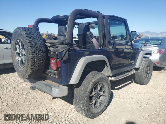 2005 Jeep Wrangler SE with VIN 1J4FA29S65P330905, listed as a Copart auction lot 71633134 with 77,598 mi miles and Salvage Title. Bid and sale history available at carsss.com. Image 3.