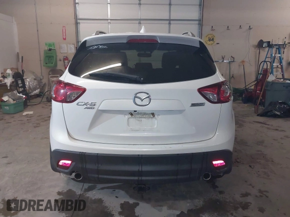 2013 Mazda CX-5 Grand Touring with VIN JM3KE4DE8D0147851, listed as a IAAI auction lot 41570695 with 94,648 mi miles. Bid and sale history available at carsss.com. Image 16.