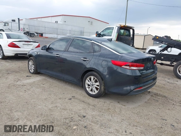 2016 Kia Optima LX with VIN 5XXGT4L38GG023697, listed as a IAAI auction lot 41976461 with 131,023 mi miles. Bid and sale history available at carsss.com. Image 3.