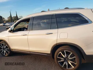 2019 Honda Pilot Touring 8-Passenger with VIN 5FNYF5H97KB005203, listed as a IAAI auction lot 41399930 with 47,267 mi miles and . Bid and sale history available at DreamBid. Image 14.