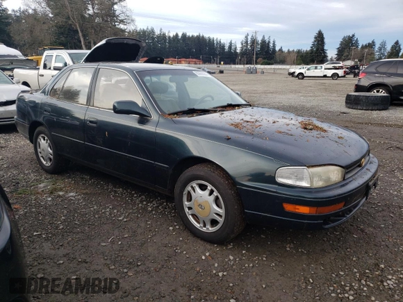1994 Toyota Camry XLE with VIN JT2GK13E2R0008225, listed as a Copart auction lot 83668084 with 258,735 mi miles and Salvage Title. Bid and sale history available at carsss.com. Image 4.
