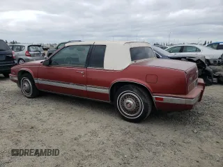 1986 Cadillac Eldorado z VIN 1G6EL5784GU616263, wystawiony jako Copart lot #48741325 z przebiegiem 59 213 mil mil oraz Tytuł czysty. Historia ofert i sprzedaży dostępna na DreamBid. Obrazek 2.