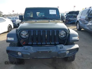 2022 Jeep Wrangler Unlimited High Tide with VIN 1C4HJXDG5NW113205, listed as a IAAI auction lot 41488724 with 30,446 mi miles and . Bid and sale history available at DreamBid. Image 13.