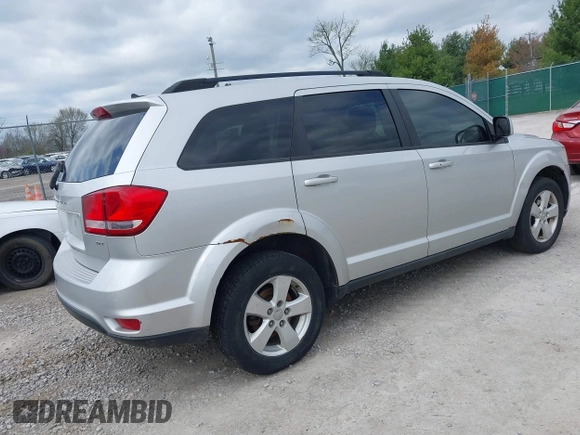 2012 Dodge Journey SXT z VIN 3C4PDDBG2CT249377, wystawiony jako IAAI lot #41948616 z przebiegiem 220 033 mil mil oraz . Historia ofert i sprzedaży dostępna na DreamBid. Obrazek 4.
