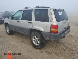 1997 Jeep Grand Cherokee Laredo with VIN 1J4GZ58Y6VC603370, listed as a Copart auction lot 82802794 with 0 mi miles and Salvage Title. Bid and sale history available at carsss.com. Image 2.