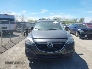 2015 Mazda CX-9 Touring z VIN JM3TB3CV3F0465162, wystawiony jako IAAI lot #42112814 z przebiegiem 108 623 mil mil oraz . Historia ofert i sprzedaży dostępna na DreamBid. Obrazek 13.