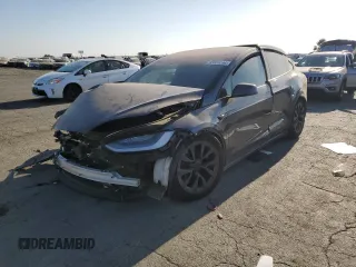 2022 Tesla Model X with VIN 7SAXCBE50NF329346, listed as a Copart auction lot 63855264 with 0 mi miles and Salvage Title. Bid and sale history available at carsss.com. Image 1.