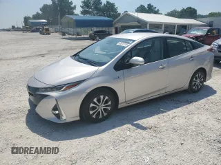 2021 Toyota Prius LE z VIN JTDKAMFP3M3187837, wystawiony jako Copart lot #60510155 z przebiegiem 80 410 mil mil oraz Szkoda całkowita • Salvage title. Historia ofert i sprzedaży dostępna na DreamBid. Obrazek 1.