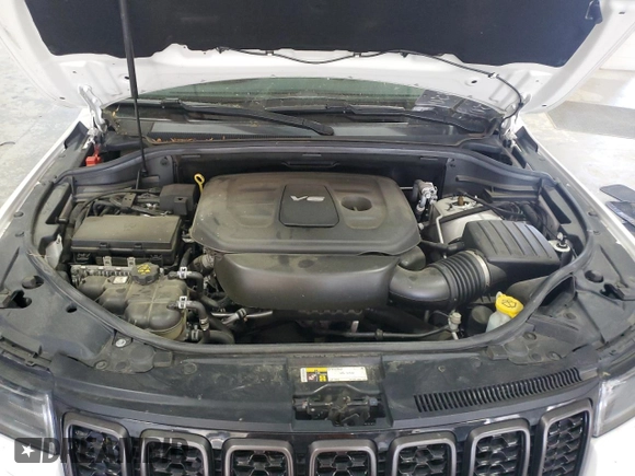 2018 Jeep Grand Cherokee Overland with VIN 1C4RJFCG5JC211145, listed as a Copart auction lot 54138865 with 115,679 mi miles and Salvage title. Bid and sale history available at DreamBid. Image 12.