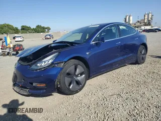 2019 Tesla Model 3 Mid Range z VIN 5YJ3E1EAXKF299345, wystawiony jako Copart lot #58335555 z przebiegiem 69 372 mil mil oraz Szkody całkowita. Historia ofert i sprzedaży dostępna na DreamBid. Obrazek 1.