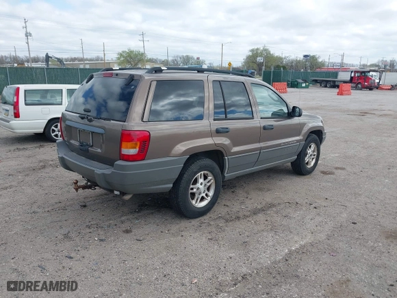 2002 Jeep Grand Cherokee Laredo with VIN 1J4GW48S32C123720, listed as a IAAI auction lot 41909204 with 157,996 mi miles. Bid and sale history available at carsss.com. Image 4.
