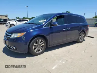 2014 Honda Odyssey Touring with VIN 5FNRL5H92EB101001, listed as a Copart auction lot 57848525 with 195,053 mi miles and Salvage title. Bid and sale history available at DreamBid. Image 1.