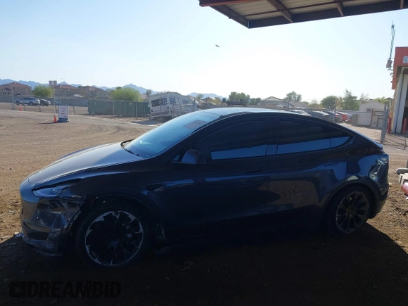 2022 Tesla Model Y Long Range with VIN 7SAYGDEE2NA017434, listed as a IAAI auction lot 41842025 with 35,164 mi miles and . Bid and sale history available at DreamBid. Image 14.
