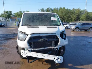 2021 Ford Transit Cargo with VIN 1FTBR1Y82MKA53386, listed as a IAAI auction lot 42058972 with 98,677 mi miles. Bid and sale history available at carsss.com. Image 6.